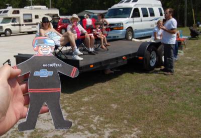 Flat Stanley watches races: Flat Stanley watches the races with some of the other spectators.