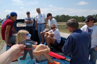 Flat Stanley visits with course workers: Flat Stanley visits with course workers at autocross.